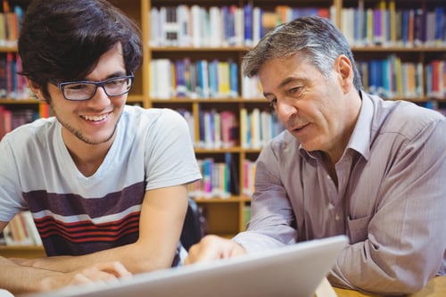 College student working with a professor